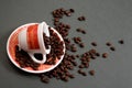 Coffee cup spilling beans Royalty Free Stock Photo