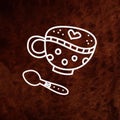 Coffee cup and spoon on brown textured background