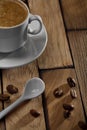 Coffee cup and spoon on wooden table Royalty Free Stock Photo