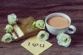 Coffee cup with spring flower lisianthus and notes I love you on Royalty Free Stock Photo