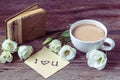 Coffee cup with spring flower lisianthus and notes I love you on Royalty Free Stock Photo