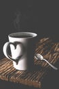 Coffee cup with steam set in low light background,Coffee in love concept.Matte style,vintage style.