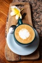 Coffee cup on stone kitchen table. Cappuccino, hot latte or coffee with milk.