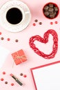 Coffee cup, sweets, lipstick, heart shape and giftbox on pink background. Women`s Day concept flat lay. Royalty Free Stock Photo