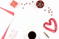 Coffee cup, sweets, lipstick, heart shape and giftbox on white background. Valentine`s Day concept frame. Royalty Free Stock Photo