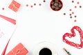 Coffee cup, sweets, lipstick, heart shape and giftbox on white background. Valentine`s Day concept frame. Royalty Free Stock Photo