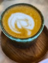 Close up white coffee cup with heart shape latte art foam. Royalty Free Stock Photo