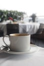 Coffee cup on a table in a cozy cafe by the sea Royalty Free Stock Photo