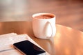 Coffee cup on the table with newspaper & mobile phone Royalty Free Stock Photo