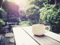 Coffee cup on table Outdoor Garden background in Morning Royalty Free Stock Photo