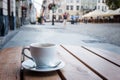 Coffee cup on a table of typical European outdoor cafe