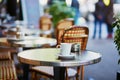 Coffee cup on a table of typical Parisian cafe Royalty Free Stock Photo