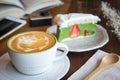 Coffee cup and tasty cake relax time book and mobile phone on ta Royalty Free Stock Photo