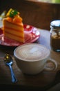 Coffee cup and tasty cake on wood table and Blank paper waiting Royalty Free Stock Photo