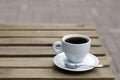 Coffee cup with tea spoon on wooden table Royalty Free Stock Photo