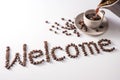 Coffee cup and text made of coffee beans, isolated on white. text the word Welcome made of coffee beans. font Royalty Free Stock Photo