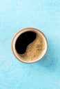 Coffee cup, top shot on a blue background with copy space Royalty Free Stock Photo