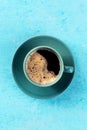 Coffee cup, top shot on a blue background, espresso drink Royalty Free Stock Photo