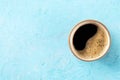 Coffee cup, top shot on a blue background with a place for text, espresso Royalty Free Stock Photo