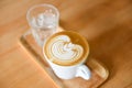 Coffee cup top view - cappuccino latte art hot coffee on wooden table background Royalty Free Stock Photo