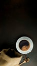 Top view of coffee cup on pile of coffee beans