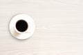 Coffee cup top view on white wooden table background Royalty Free Stock Photo