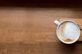 Coffee cup top view on wooden table background Royalty Free Stock Photo