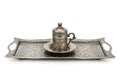 Coffee cup and tray with arabic decoration with metal cup and dish on a white background