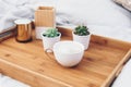 Coffee cup on tray. Styled morning at home