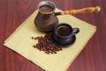 Coffee in cup and vintage copper coffee pot, coffee beans Royalty Free Stock Photo