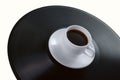 Coffee-cup on vinyl record Royalty Free Stock Photo