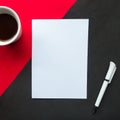 Coffee cup, white mockup blank and pen on geometric red and black background. Royalty Free Stock Photo