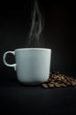 Coffee cup white with smoke on black background. Royalty Free Stock Photo