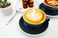 Coffee cup on white table at cafe background, top view, food and drink concept