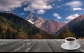 Coffee cup on wood table and view of beautiful nature background Royalty Free Stock Photo