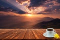 Coffee cup on wood table and view of beautiful nature background Royalty Free Stock Photo