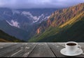 Coffee cup on wood table and view of beautiful nature background Royalty Free Stock Photo