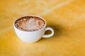 Coffee cup and on a wooden table Royalty Free Stock Photo