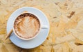 Coffee cup on a wooden table Royalty Free Stock Photo