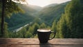 Coffee cup on wooden table in front of beautiful mountain landscape Royalty Free Stock Photo