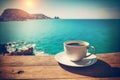 Coffee cup on wooden table over beautiful sea background AI Generated Royalty Free Stock Photo