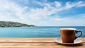 Coffee cup on wooden table over blue sea and sky background Royalty Free Stock Photo