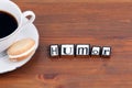 Coffee cup on a wooden table and text - Humor Royalty Free Stock Photo