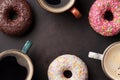 Coffee cups and colorful donuts Royalty Free Stock Photo