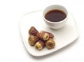 A coffee cups and dates.