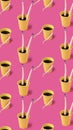 Coffee cups with female doll hands, legs and head on pink background