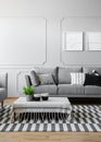 Coffee cups and green plant in pot on the low coffee table covered with striped tablecloth in modern living room designed in shade Royalty Free Stock Photo