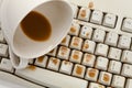 Coffee and damaged computer keyboard Royalty Free Stock Photo
