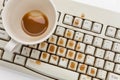 Coffee and damaged computer keyboard Royalty Free Stock Photo