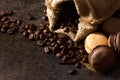 Coffee on dark background with macaroons and sugar crystals